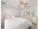 Bright bedroom featuring white walls, ceiling fan, closet, dresser and neutral decor at 8199 Nordica Rd, Weeki Wachee, FL 34613