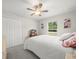 Cozy bedroom featuring plush carpet, neutral paint, and a classic ceiling fan at 8199 Nordica Rd, Weeki Wachee, FL 34613