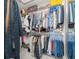 Walk-in closet with clothing racks and shelving, providing ample storage space at 8199 Nordica Rd, Weeki Wachee, FL 34613