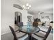 Dining area with stylish table and seating, open to the kitchen and office space at 8199 Nordica Rd, Weeki Wachee, FL 34613