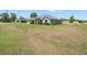 Expansive view of home's exterior with a large lawn, showcasing its curb appeal and location at 8199 Nordica Rd, Weeki Wachee, FL 34613