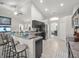 Spacious kitchen features a breakfast bar and stainless steel appliances, seamlessly connecting to dining space at 8199 Nordica Rd, Weeki Wachee, FL 34613