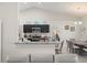 Open kitchen and dining area with stainless steel appliances, modern cabinets, and bar seating at 8199 Nordica Rd, Weeki Wachee, FL 34613