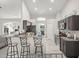 Kitchen includes modern appliances, dark cabinetry and stone countertops, with an eat-in breakfast bar at 8199 Nordica Rd, Weeki Wachee, FL 34613