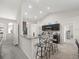 Modern kitchen with dark cabinets, a breakfast bar, and stainless steel appliances at 8199 Nordica Rd, Weeki Wachee, FL 34613