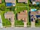 Expansive aerial view of a single Gathering home with lush lawn and mature trees at 8401 Pavilion Dr, Hudson, FL 34667