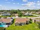Aerial view of home showing landscaped yard and neighborhood location at 8401 Pavilion Dr, Hudson, FL 34667