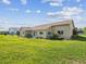 Backyard with lush lawn featuring beautiful landscaping and a serene setting at 8401 Pavilion Dr, Hudson, FL 34667