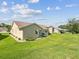 A lush, green backyard with manicured landscaping and serene setting at 8401 Pavilion Dr, Hudson, FL 34667