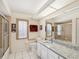 Bathroom with tile flooring, shower with glass door, and granite-topped vanity at 8401 Pavilion Dr, Hudson, FL 34667