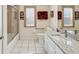 Bathroom featuring granite counters, white tile floor, shower, and bath tub combo at 8401 Pavilion Dr, Hudson, FL 34667