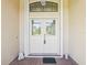 Elegant double front door with decorative glass detailing, framed by charming angel statues at 8401 Pavilion Dr, Hudson, FL 34667
