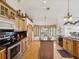 Bright kitchen with wood cabinets, granite countertops, and modern stainless steel appliances at 8401 Pavilion Dr, Hudson, FL 34667
