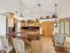Spacious kitchen featuring wood cabinets, granite countertops, and breakfast bar at 8401 Pavilion Dr, Hudson, FL 34667