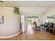 Bright living room features vaulted ceilings, hardwood floors, and neutral paint at 8401 Pavilion Dr, Hudson, FL 34667