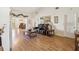 Inviting living room boasts a vaulted ceiling, wood floors, and comfortable leather seating at 8401 Pavilion Dr, Hudson, FL 34667