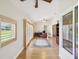 Bright home office featuring natural light, shutters, and wood-look flooring at 8401 Pavilion Dr, Hudson, FL 34667