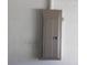 Gray electrical panel mounted on the wall in unfinished basement or utility room at 846 Burlwood St, Brandon, FL 33511