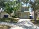 Two-story home with a two-car garage and a neatly maintained front lawn and mature trees at 846 Burlwood St, Brandon, FL 33511