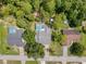 An aerial view shows a neighborhood with various homes, showcasing their pool and yard sizes at 8979 Hernando Way, Weeki Wachee, FL 34613