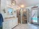 Bright bathroom featuring a glass shower, tile floors, and vanity at 8979 Hernando Way, Weeki Wachee, FL 34613