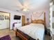 Cozy bedroom with a ceiling fan, decorative wall art and a beachy theme at 8979 Hernando Way, Weeki Wachee, FL 34613