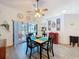 Dining room with stylish table setting and sliding glass doors to outdoor entertainment area at 8979 Hernando Way, Weeki Wachee, FL 34613