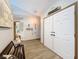 Inviting entryway with wood-look flooring, ample closet space, and decorative coastal accents at 8979 Hernando Way, Weeki Wachee, FL 34613