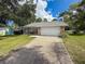 Charming single-Gathering home with a lush green lawn and a convenient two-car garage in a desirable neighborhood at 8979 Hernando Way, Weeki Wachee, FL 34613