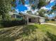 Charming single-story home with a well-manicured lawn and stone accents, offering great curb appeal at 8979 Hernando Way, Weeki Wachee, FL 34613