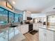 Well-lit kitchen featuring granite countertops, stainless steel appliances, a bay window, and an open floor plan at 8979 Hernando Way, Weeki Wachee, FL 34613