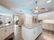 Spacious kitchen with a center island, granite countertops, stainless steel appliances, and ample cabinet space at 8979 Hernando Way, Weeki Wachee, FL 34613
