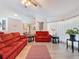 Bright living room with tile floors, comfortable seating, and plenty of natural light at 8979 Hernando Way, Weeki Wachee, FL 34613