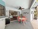 A covered outdoor patio features an outdoor ceiling fan and bar, perfect for entertaining at 8979 Hernando Way, Weeki Wachee, FL 34613
