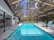 The screened pool boasts a covered patio with a dining area and comfortable seating at 8979 Hernando Way, Weeki Wachee, FL 34613