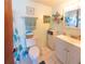 Bathroom featuring tile flooring, vanity, and framed mirror; perfect for a clean and functional space at 9134 Crabtree Ln, Port Richey, FL 34668