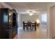 Dining room features tile flooring, a modern ceiling fan, and sliding glass doors to outdoor space at 9134 Crabtree Ln, Port Richey, FL 34668