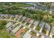 An aerial view captures a residential community next to a golf course and several ponds, with homes closely nestled together at 9149 Penelope Dr, Weeki Wachee, FL 34613
