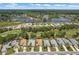 Birds-eye view showing a home nestled among manicured lawns, serene lakes, and a golf course, offering a resort-style living at 9149 Penelope Dr, Weeki Wachee, FL 34613