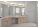 Bathroom with a spacious vanity with double sinks and great lighting at 9149 Penelope Dr, Weeki Wachee, FL 34613
