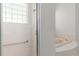 Bright bathroom featuring glass enclosed shower and tub at 9149 Penelope Dr, Weeki Wachee, FL 34613