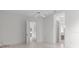 Neutral bedroom with a ceiling fan, and easy access to the bathroom at 9149 Penelope Dr, Weeki Wachee, FL 34613