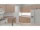 Kitchen featuring tile flooring, neutral countertops and plenty of cabinets at 9149 Penelope Dr, Weeki Wachee, FL 34613