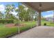 Screened-in lanai with lovely backyard view and access to the outdoors at 9149 Penelope Dr, Weeki Wachee, FL 34613