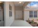 A screened-in patio featuring double doors and a view of the backyard at 9149 Penelope Dr, Weeki Wachee, FL 34613