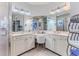 Bright, spacious bathroom featuring a double vanity, and glass-enclosed shower at 9406 Burnam Dr, Weeki Wachee, FL 34613