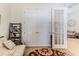 This bedroom features carpet floors, a comfortable futon and nearby closet at 9406 Burnam Dr, Weeki Wachee, FL 34613