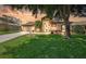 Charming single-Gathering home with lush front lawn, mature trees and inviting entrance at 9406 Burnam Dr, Weeki Wachee, FL 34613