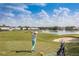 Scenic view of the golf course at GlenLakes with a pond and fountain at 9406 Burnam Dr, Weeki Wachee, FL 34613