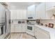 Well-lit kitchen featuring stainless steel appliances, and ample counter space at 9406 Burnam Dr, Weeki Wachee, FL 34613